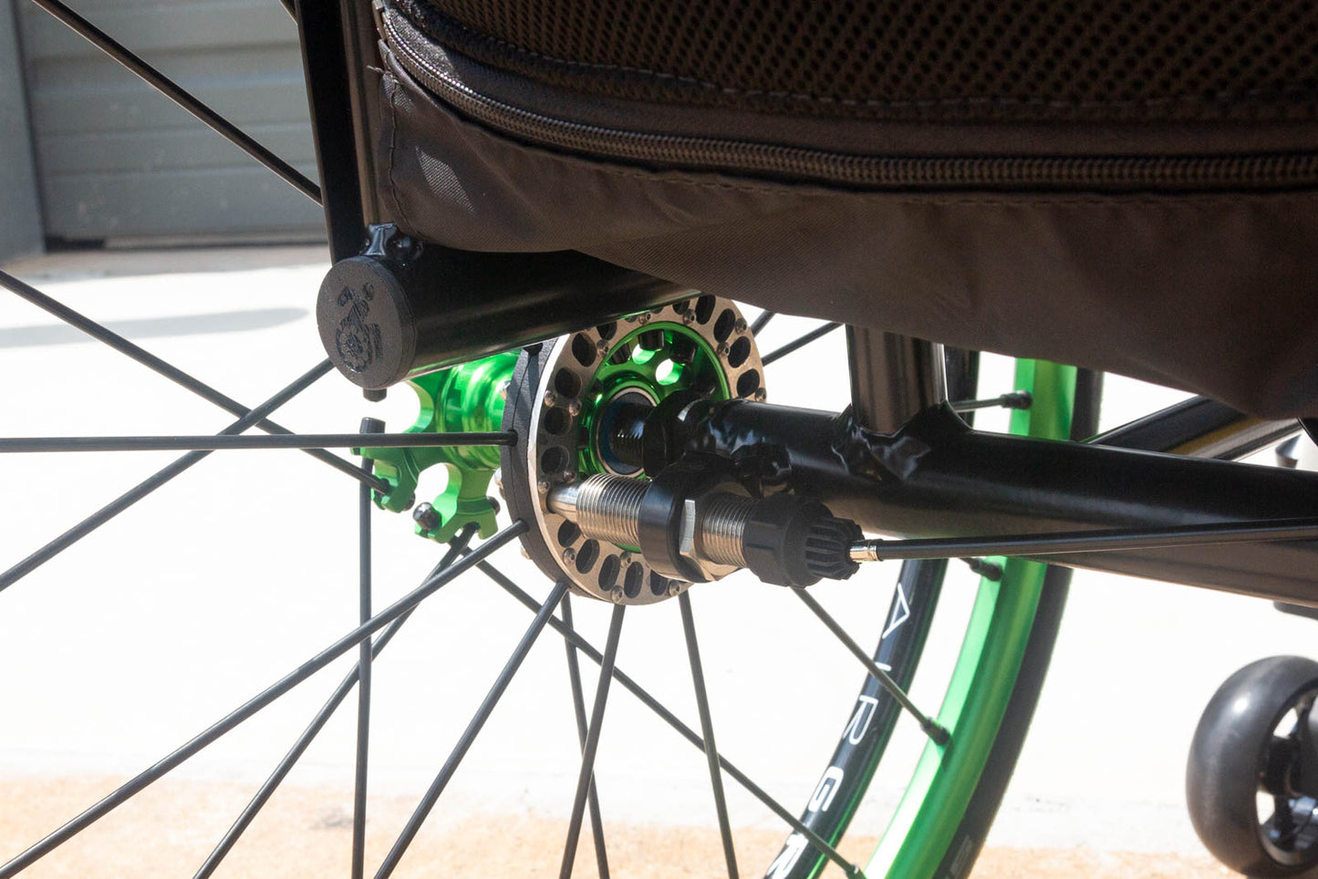 Push Lox Locking Hub Rings and Locking Pin Mounted to a Spinergy XSLX Wheelchair Wheels on a Reckless Wheelchair